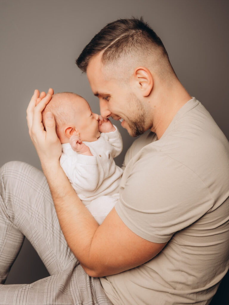 a man holding a baby